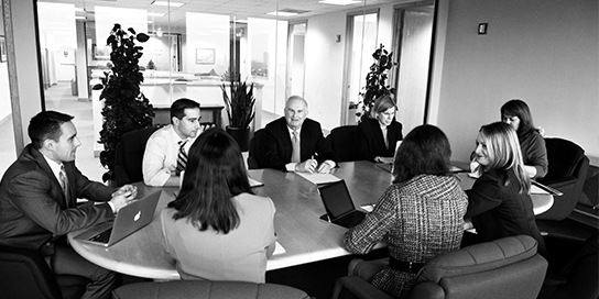 lawyers gathered around a table